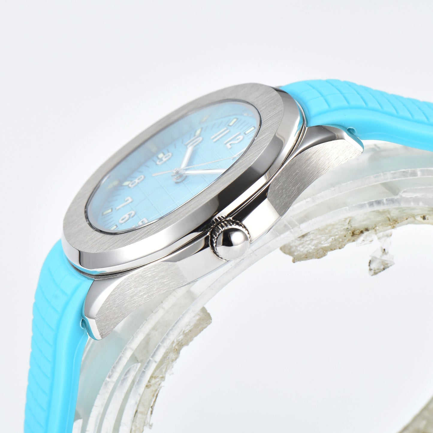 Side view of silver Aquanaut style Seiko mod watch, polished silver case and crown detail