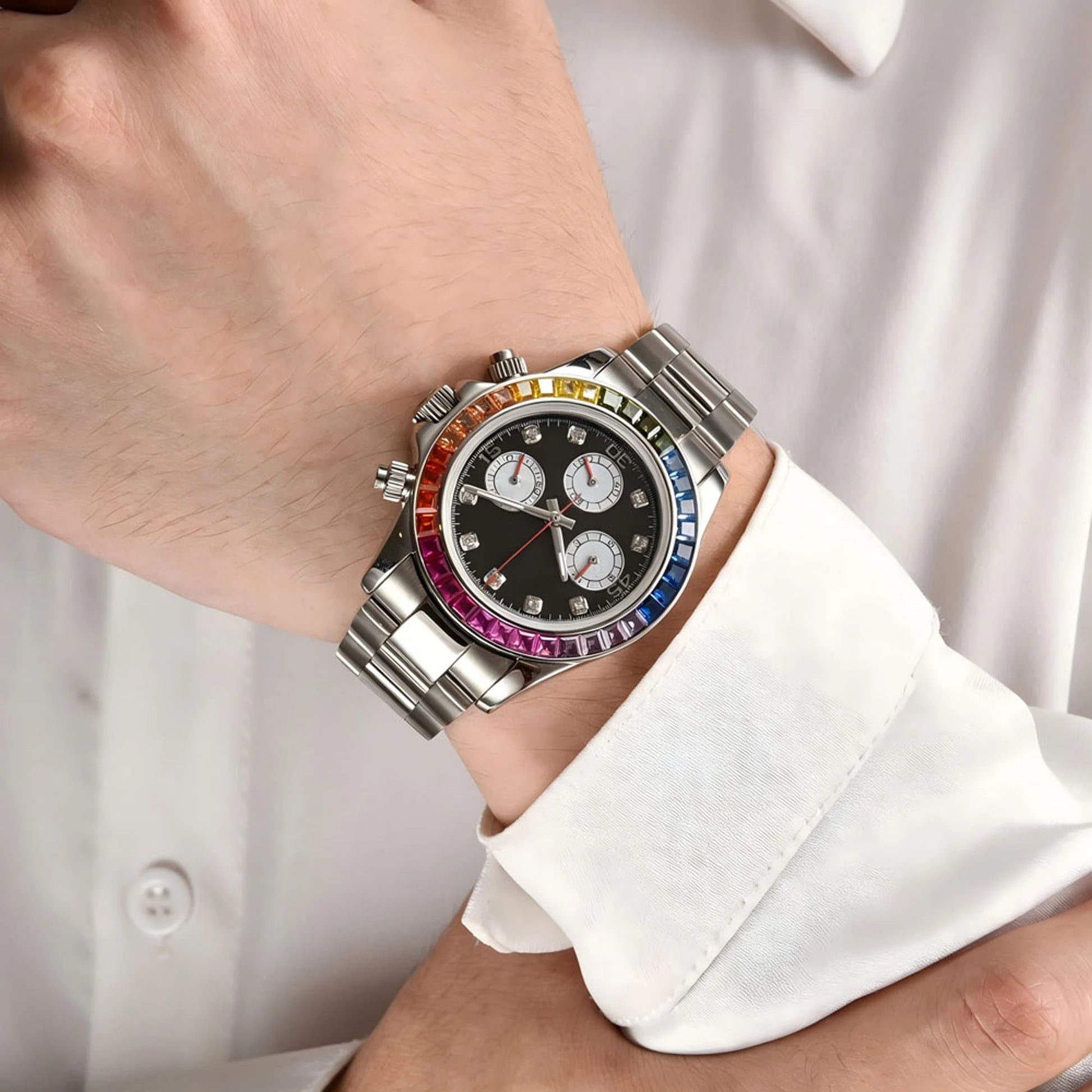 Men's rainbow gem bezel Daytona style Seiko mod chronograph watch on wrist, business lifestyle shot