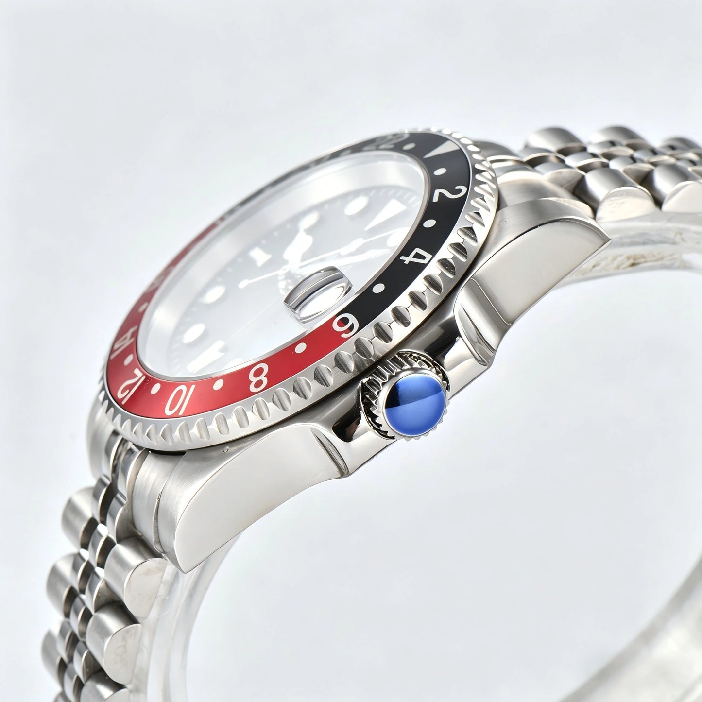Side view of Seiko modified GMT Cola watch showing signed screw-down crown and sapphire crystal
