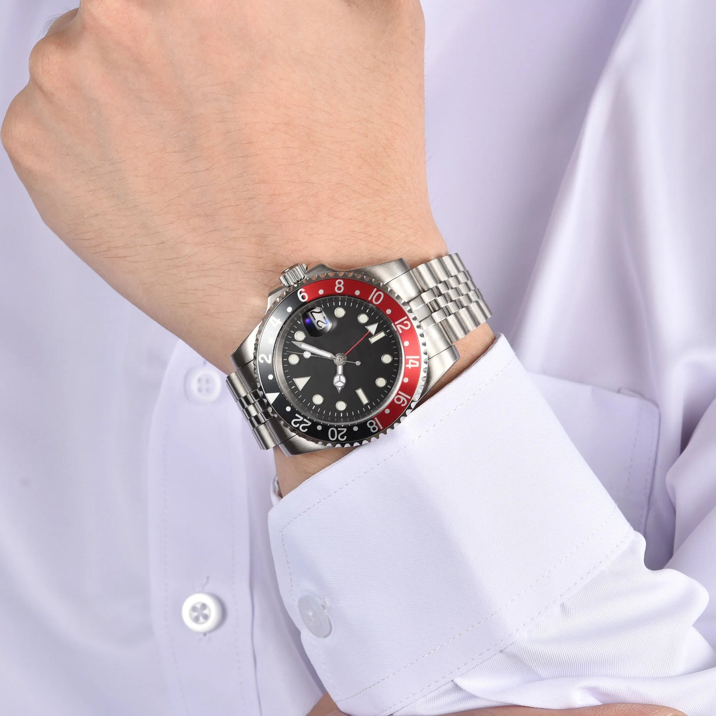 Wrist shot of custom Seiko nh34 mod Cola GMT watch with sapphire crystal and black red bezel