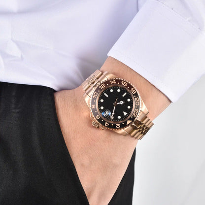 Wrist shot of custom GMT Seiko mod watch worn with a formal suit, showcasing the polished finish and refined dial details