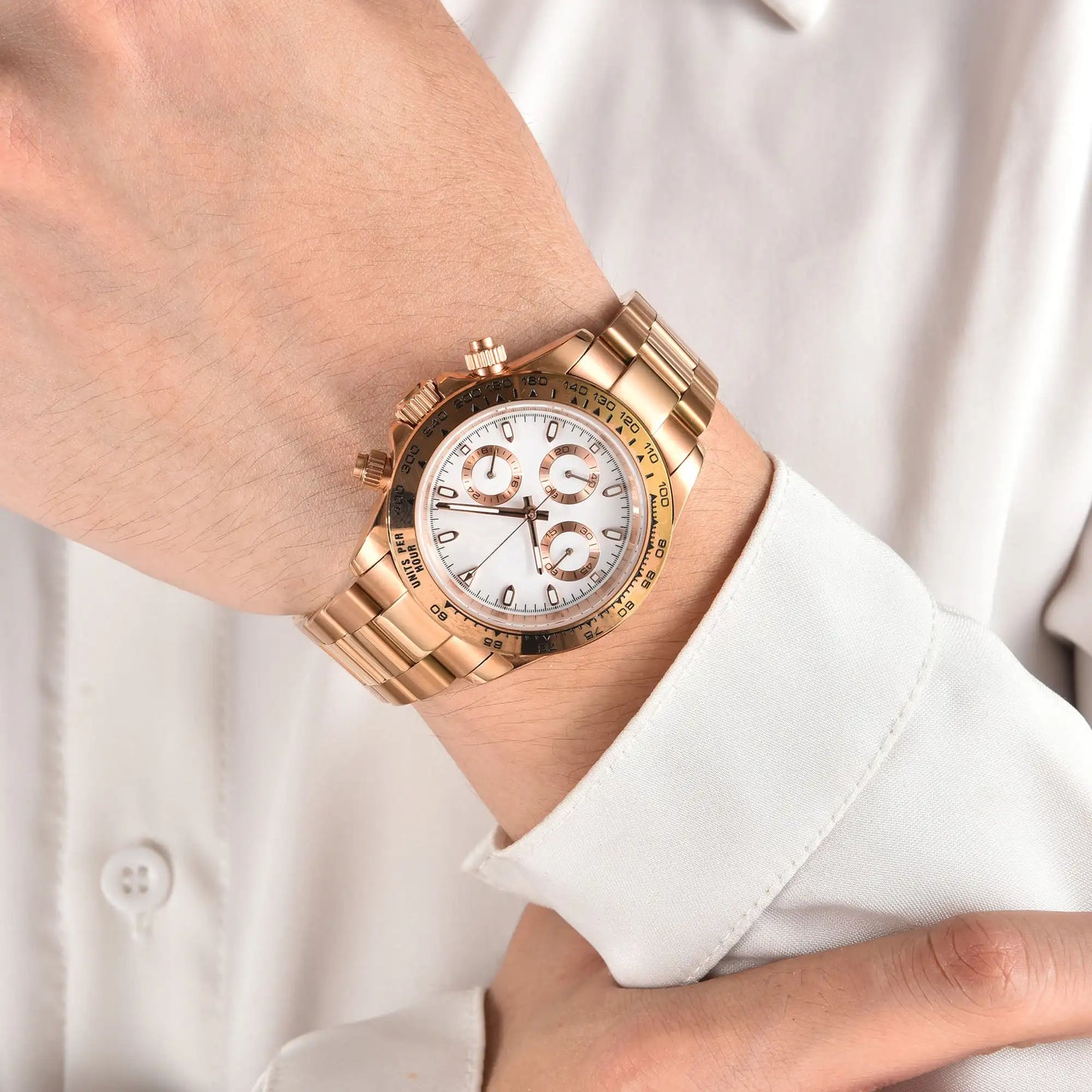 Men's rose gold white VK63 Daytona style Seiko mod chronograph watch on wrist, business lifestyle shot