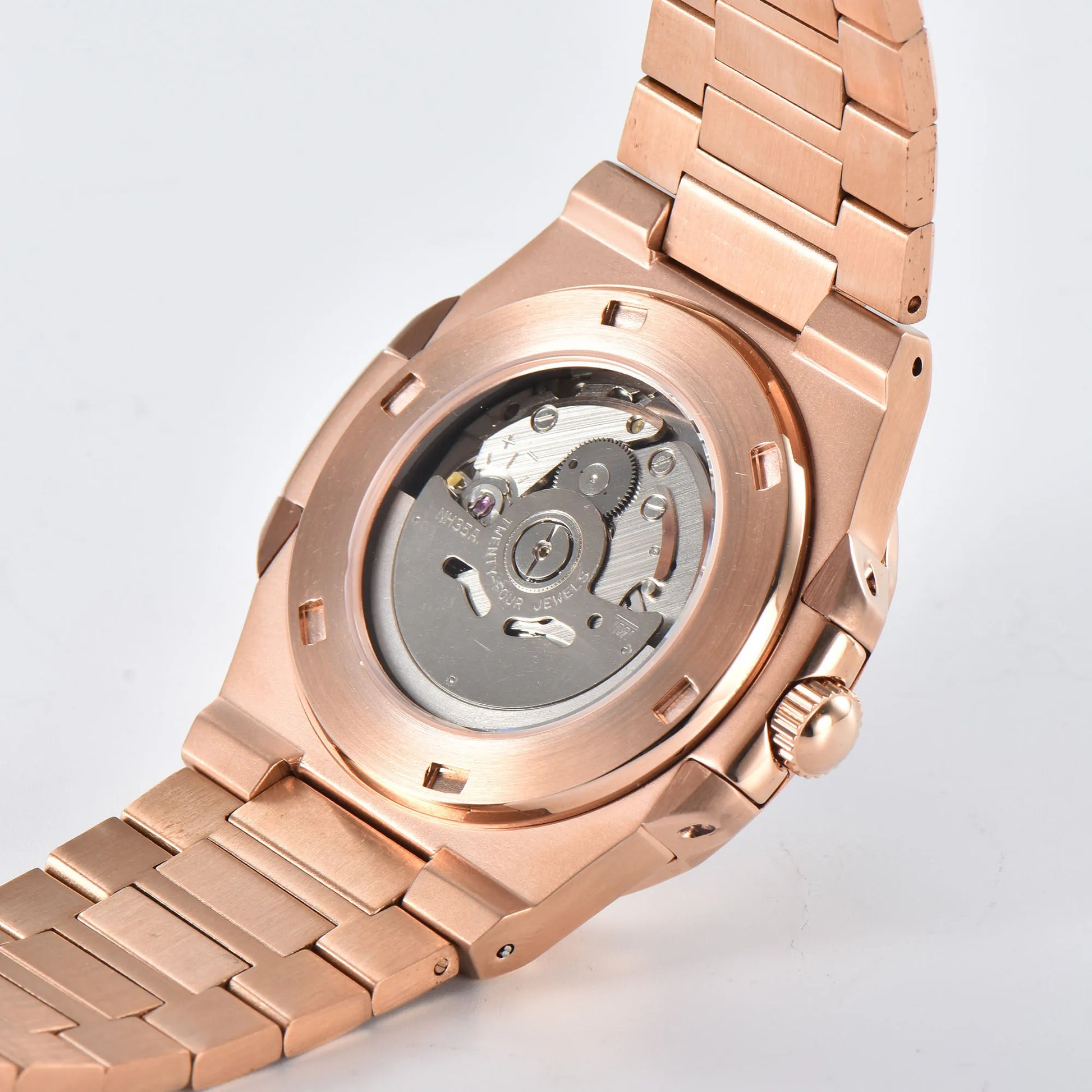 Clear case back showing Seiko NH35 automatic movement in rose gold Nautilus style Seiko mod watch