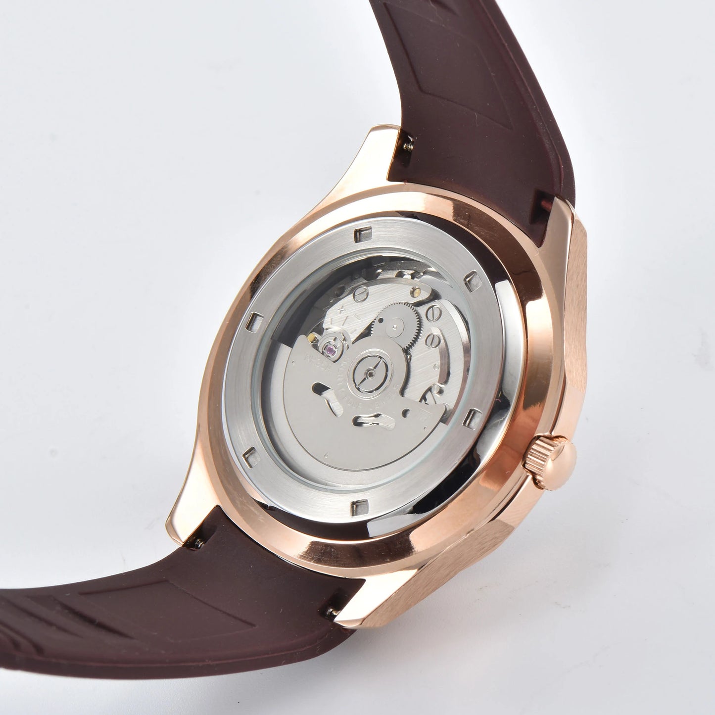 Clear case back showing Seiko NH35 automatic movement in rose gold Aquanaut style Seiko mod watch