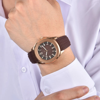 Rose gold Aquanaut style Seiko mod watch with brown rubber strap on wrist, business lifestyle shot