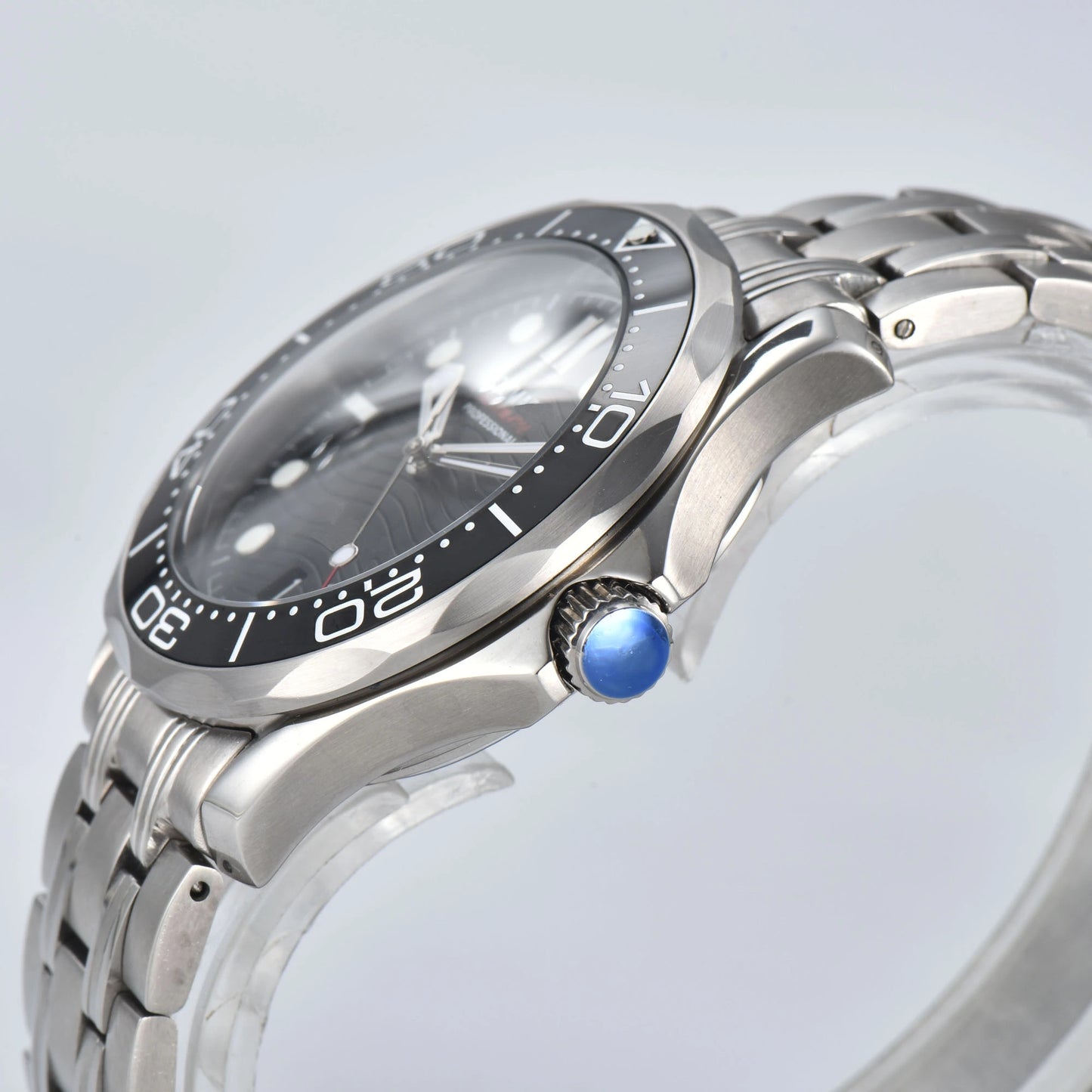 Side view of Seamaster style Seiko mod watch, silver crown and black ceramic bezel detail