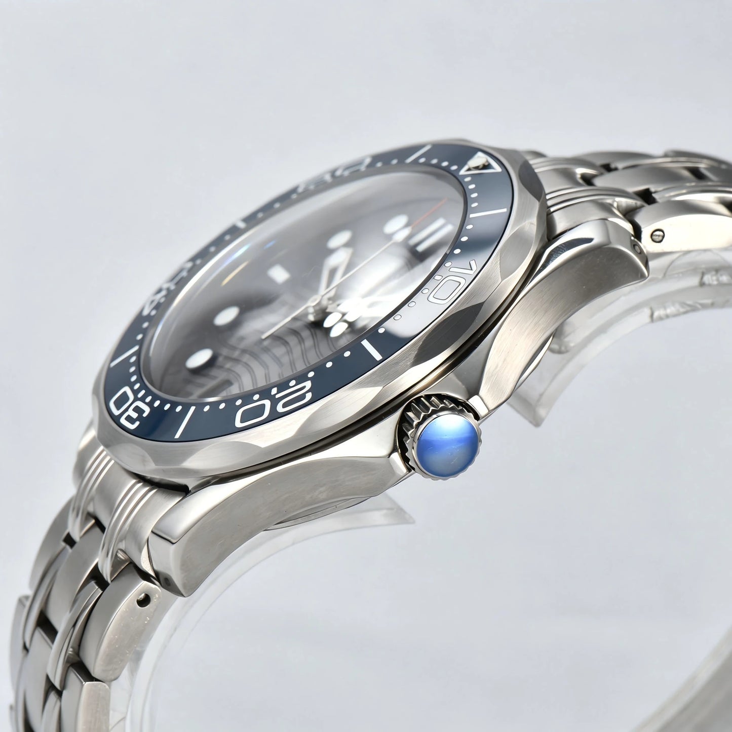 Side view of Seamaster style Seiko mod watch, silver crown and blue ceramic bezel detail