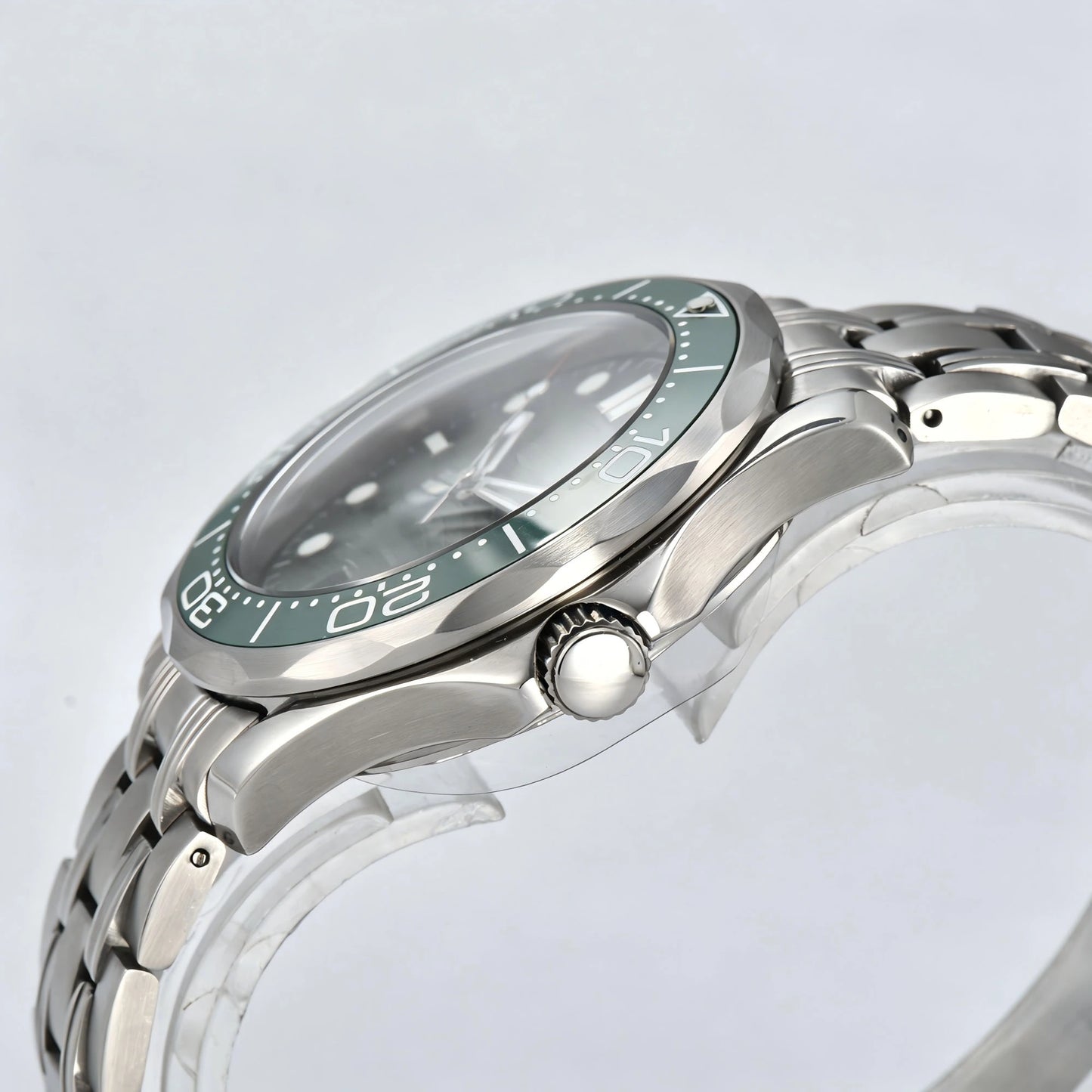 Side view of Seamaster style Seiko mod watch, silver crown and green ceramic bezel detail