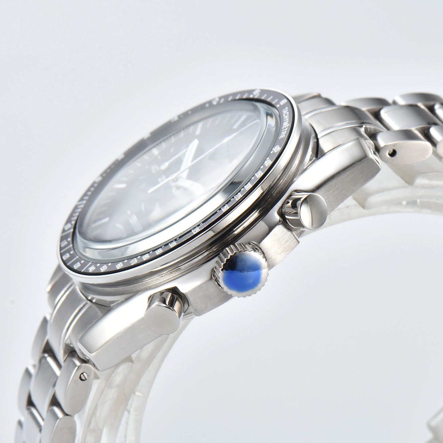 Side view of chronograph style Seiko mod watch, stainless steel pushers and tachymeter bezel detail