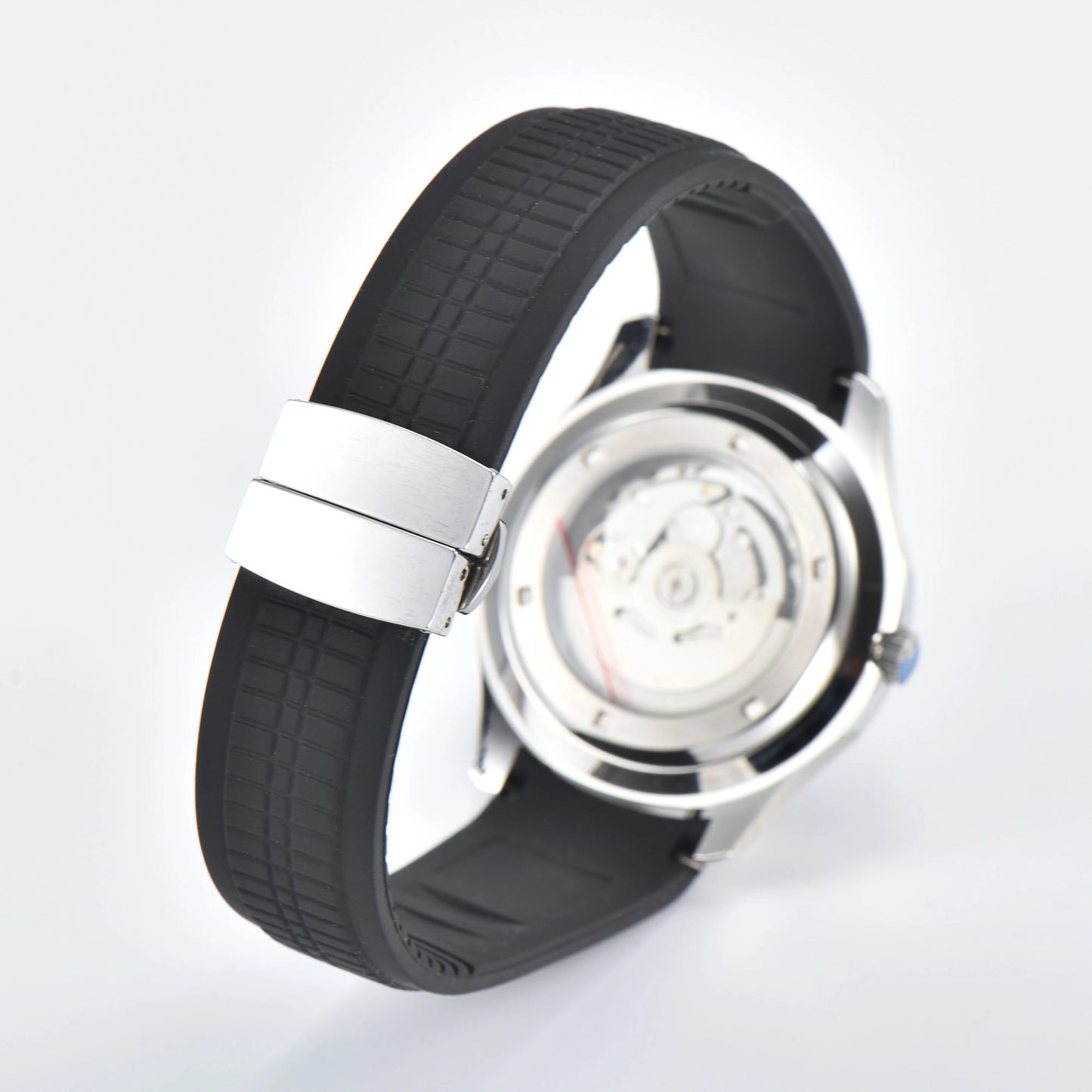 Transparent case back and deployment clasp of silver Aquanaut style Seiko mod watch with black rubber strap