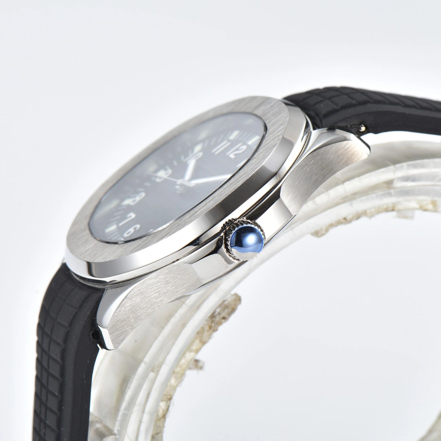 Side view of silver Aquanaut style Seiko mod watch, polished silver case and crown detail