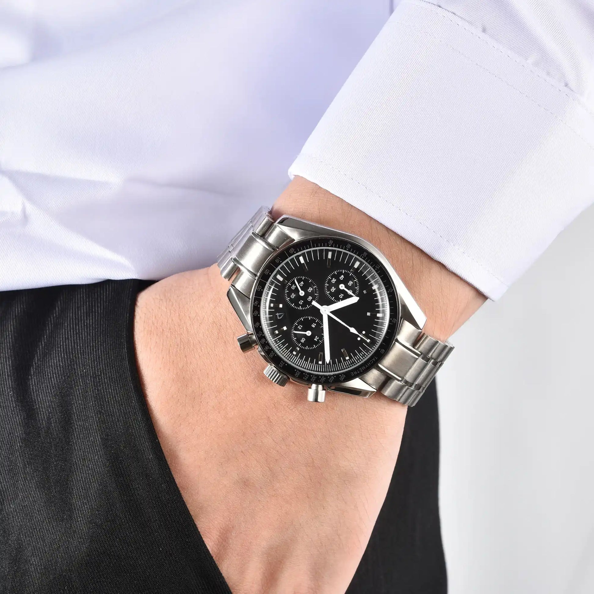 Men's silver chronograph speedmaster Seiko mod watch on wrist, casual daily wear shot