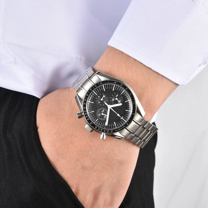 Men's silver chronograph speedmaster Seiko mod watch on wrist, casual daily wear shot