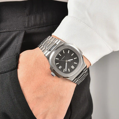 Men's black dial Nautilus style Seiko mod watch on wrist, casual daily wear lifestyle shot