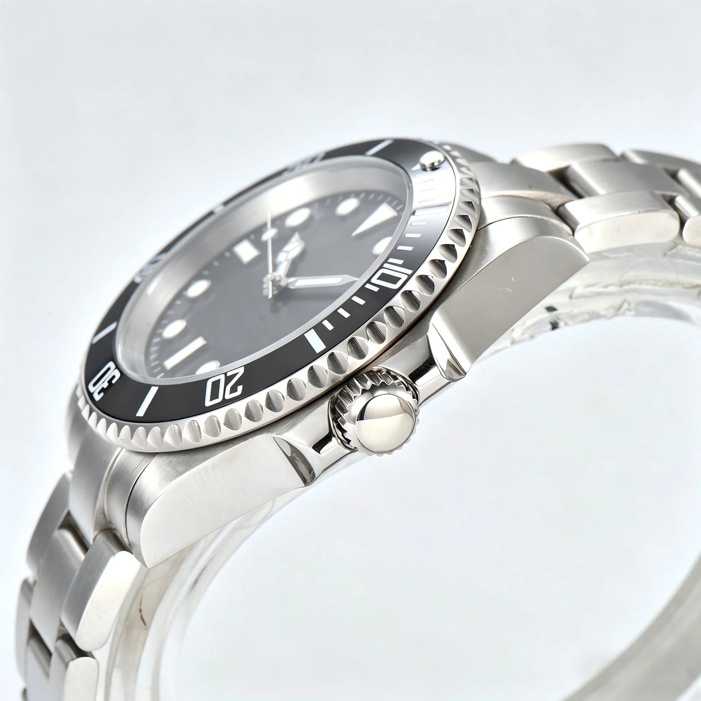 Side view of silver black Seiko mod watch, Submariner style with polished stainless steel case