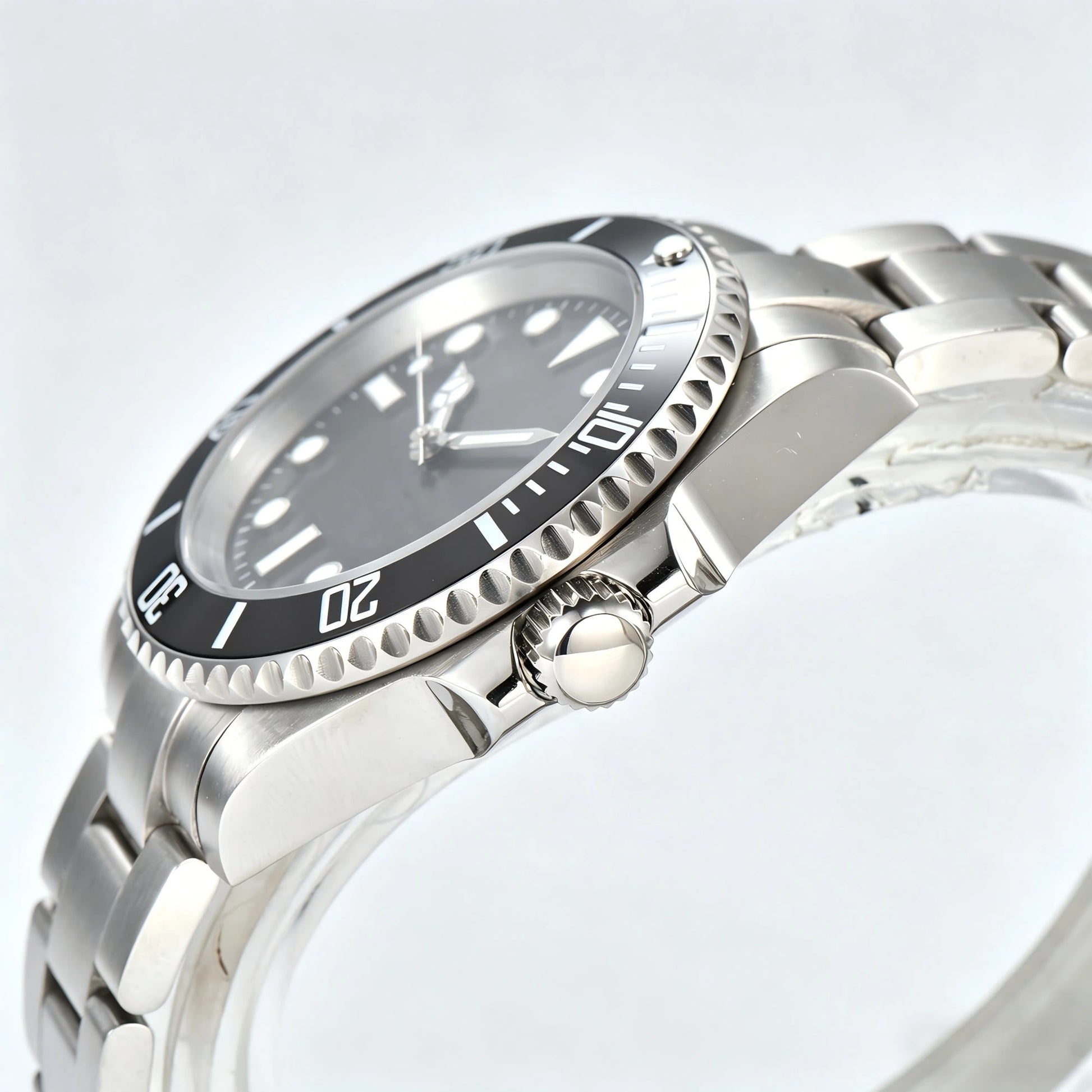 Side view of silver black Seiko mod watch, Submariner style with polished stainless steel case