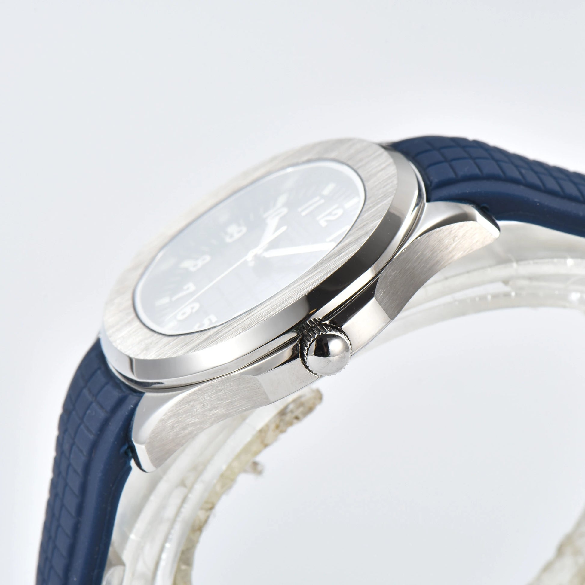 Side view of silver Aquanaut style Seiko mod watch, polished silver case and crown detail