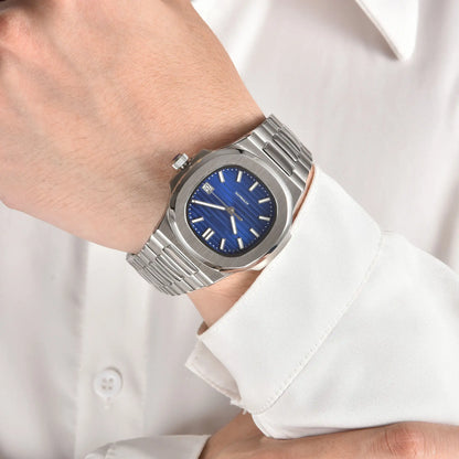 Blue dial Nautilus style Seiko mod watch with stainless steel bracelet on wrist, business lifestyle shot