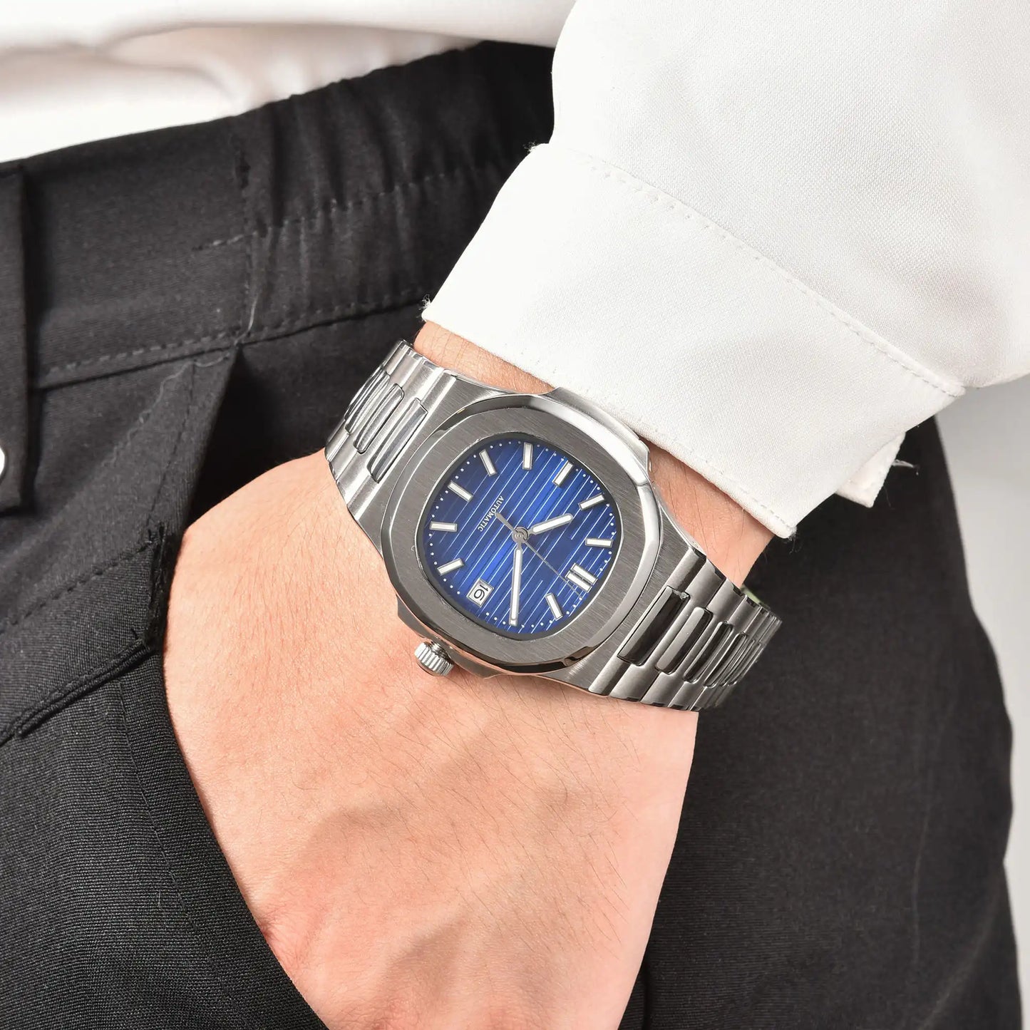 Men's blue dial Nautilus style Seiko mod watch on wrist, casual daily wear lifestyle shot