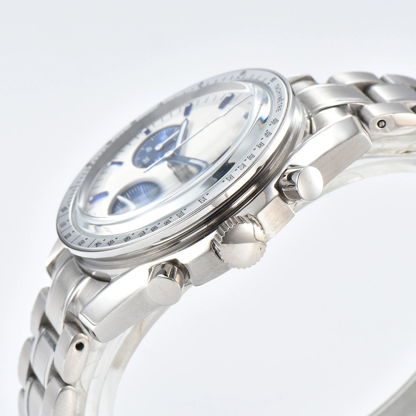 Side view of chronograph style Seiko mod watch, stainless steel pushers and tachymeter bezel detail