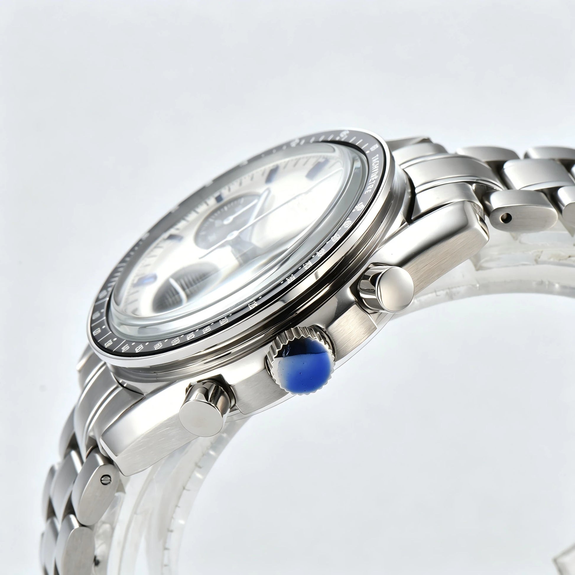 Side view of chronograph style Seiko mod watch, stainless steel pushers and tachymeter bezel detail