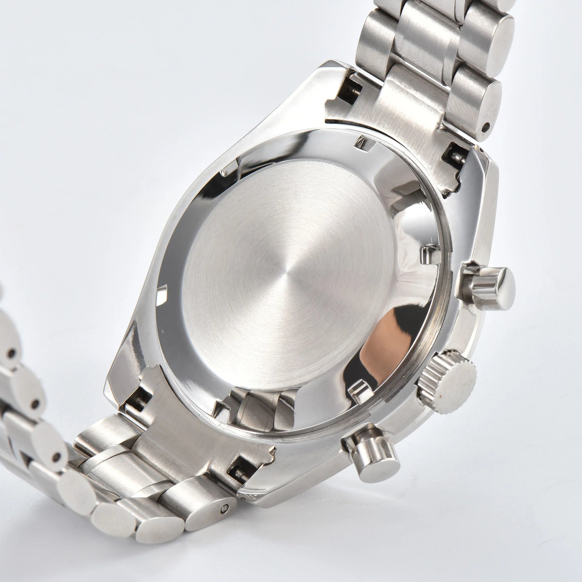 Side view of silver Seiko mod chronograph watch, polished stainless steel case back