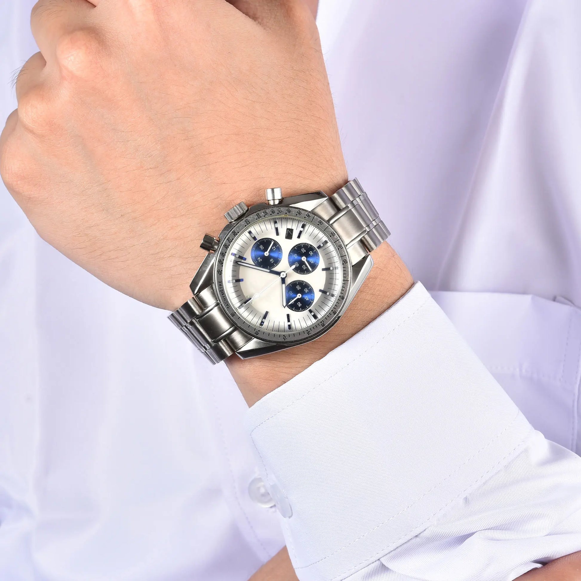 Silver chronograph style Seiko mod speedmaster watch on wrist, business lifestyle shot