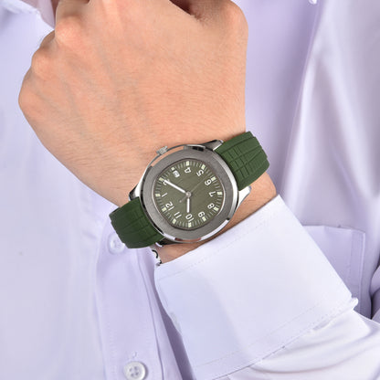 Silver green Aquanaut style Seiko mod watch with green rubber strap on wrist, business lifestyle shot