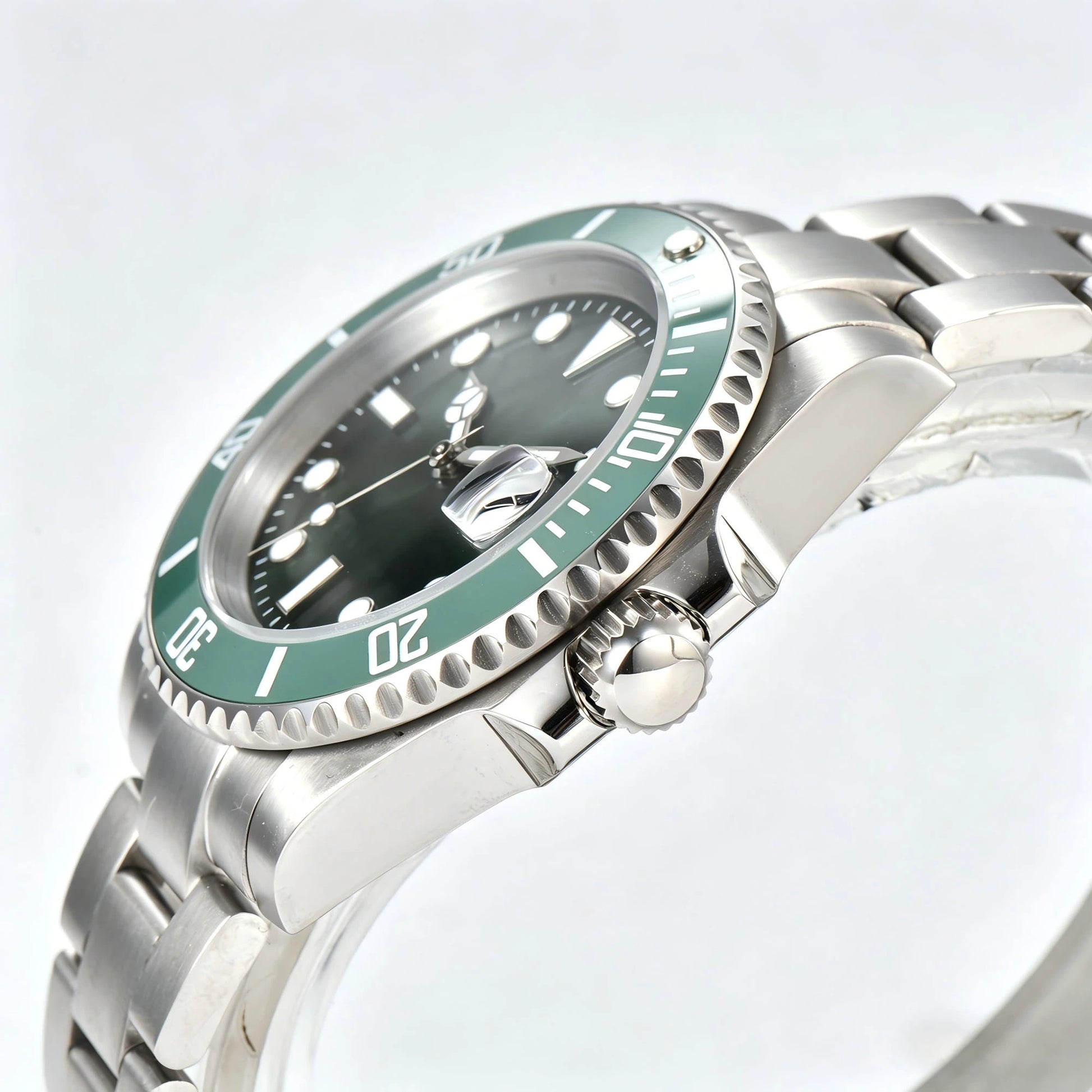 Side view of green bezel Seiko mod watch, Submariner style with polished stainless steel case