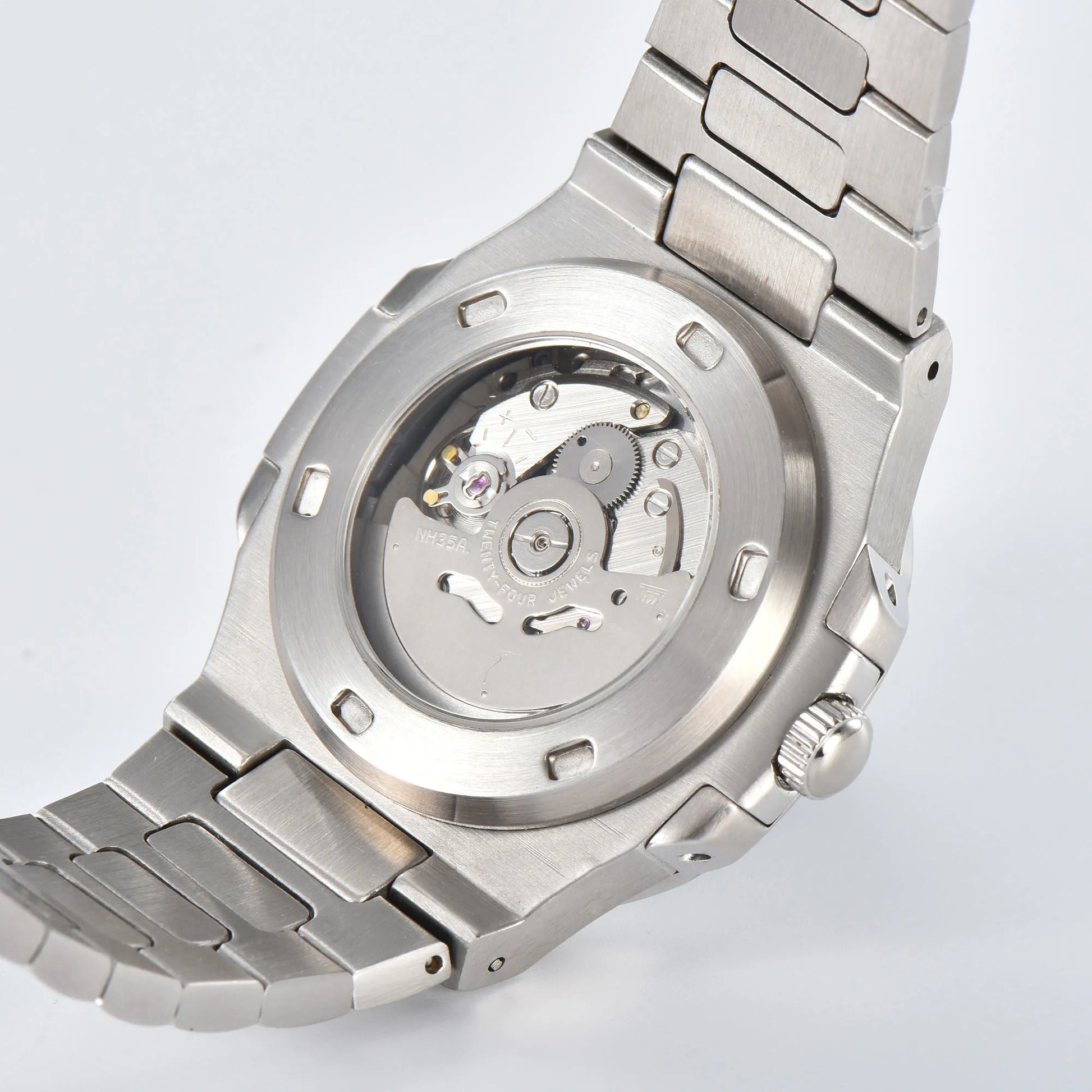 Clear case back showing Seiko NH35 automatic movement in silver Nautilus style Seiko mod watch