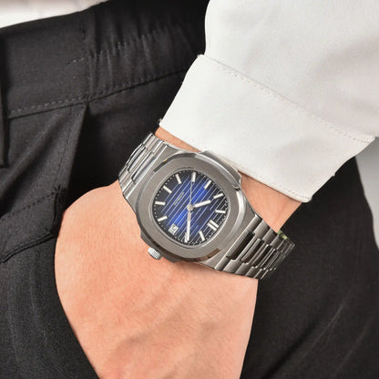 Men's blue gradient dial Nautilus style Seiko mod watch on wrist, casual daily wear lifestyle shot
