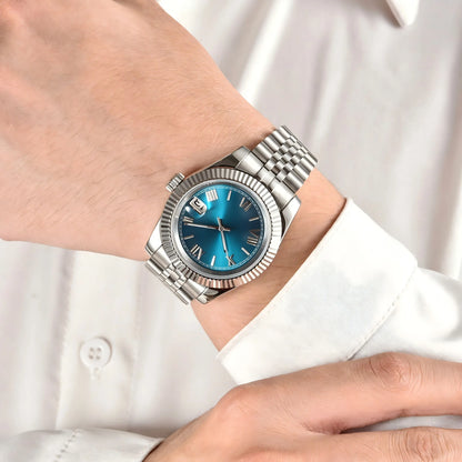 Wrist shot of custom Seiko nh35 datejust mod watch with sapphire crystal and Roman teal blue dial