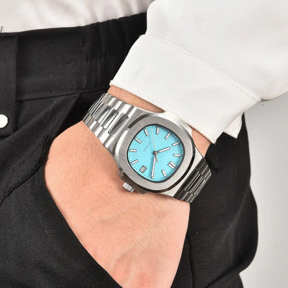 Men's tiffany blue dial Nautilus style Seiko mod watch on wrist, casual daily wear lifestyle shot