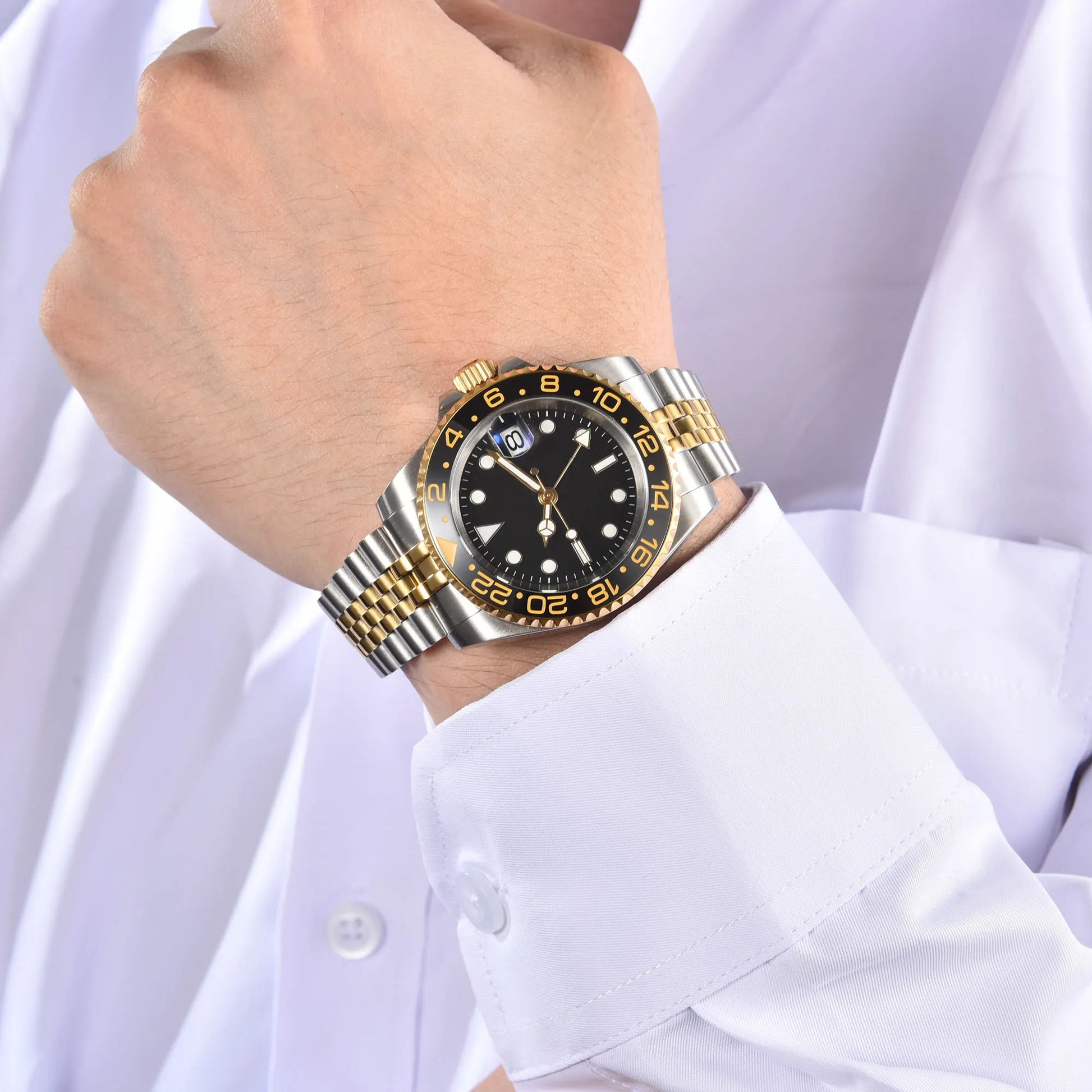 Wrist shot of custom Seiko nh34 GMT mod watch with sapphire crystal Two-Tone gold case