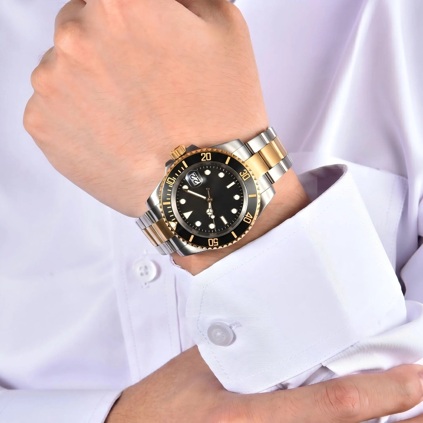 Men's two-tone gold black Seiko mod watch on wrist, Submariner style business lifestyle shot