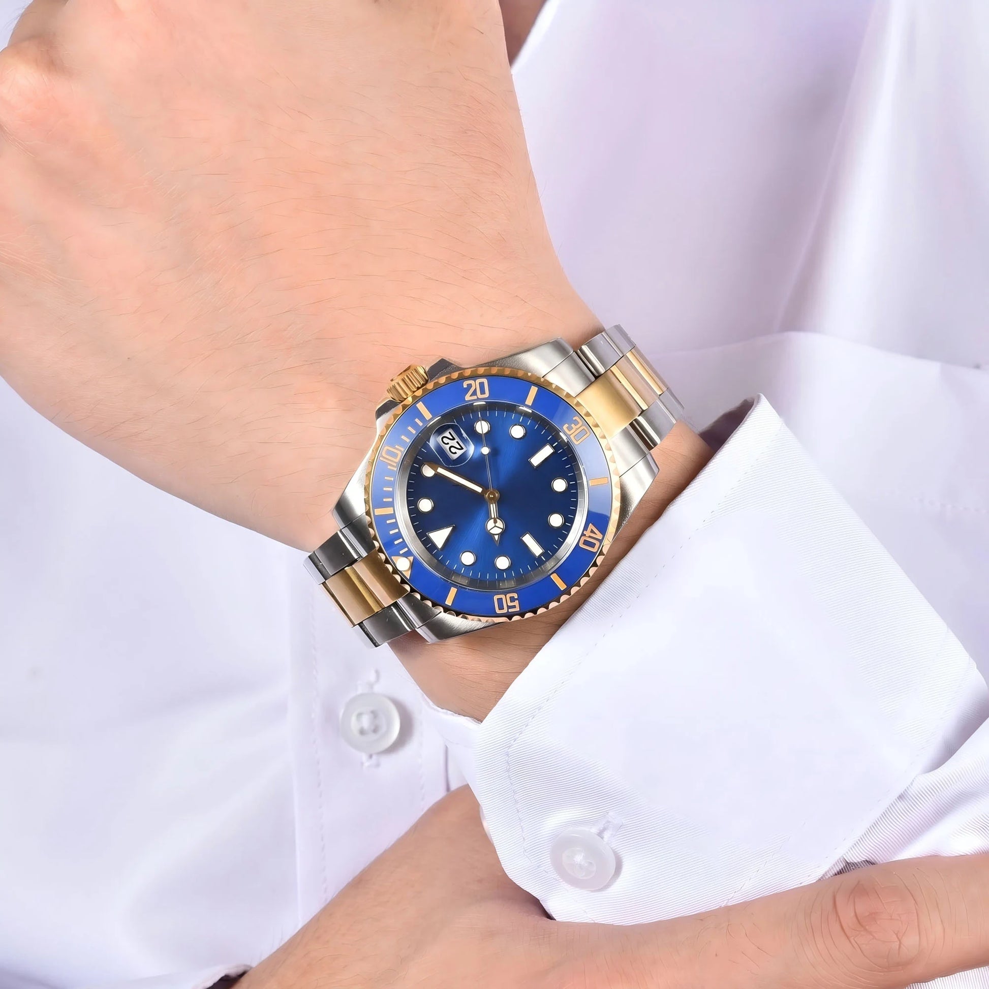 Men's two-tone gold blue Seiko mod watch on wrist, Submariner style business lifestyle shot