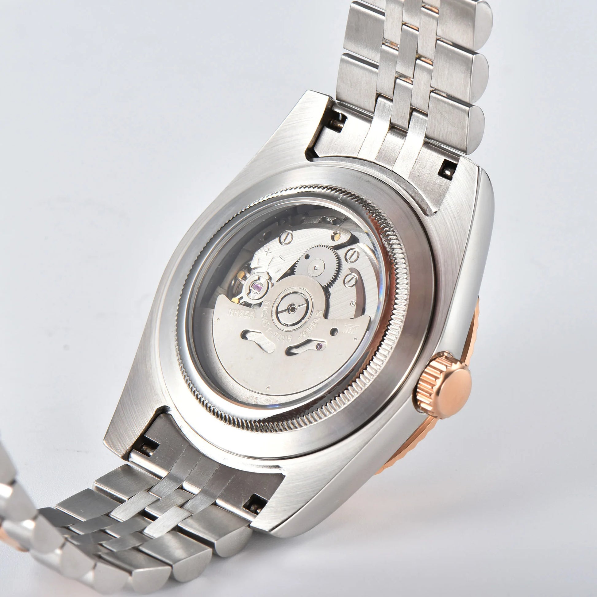 Custom Seiko mod watch with exhibition case back showing Seiko NH35 automatic movement with custom rotor