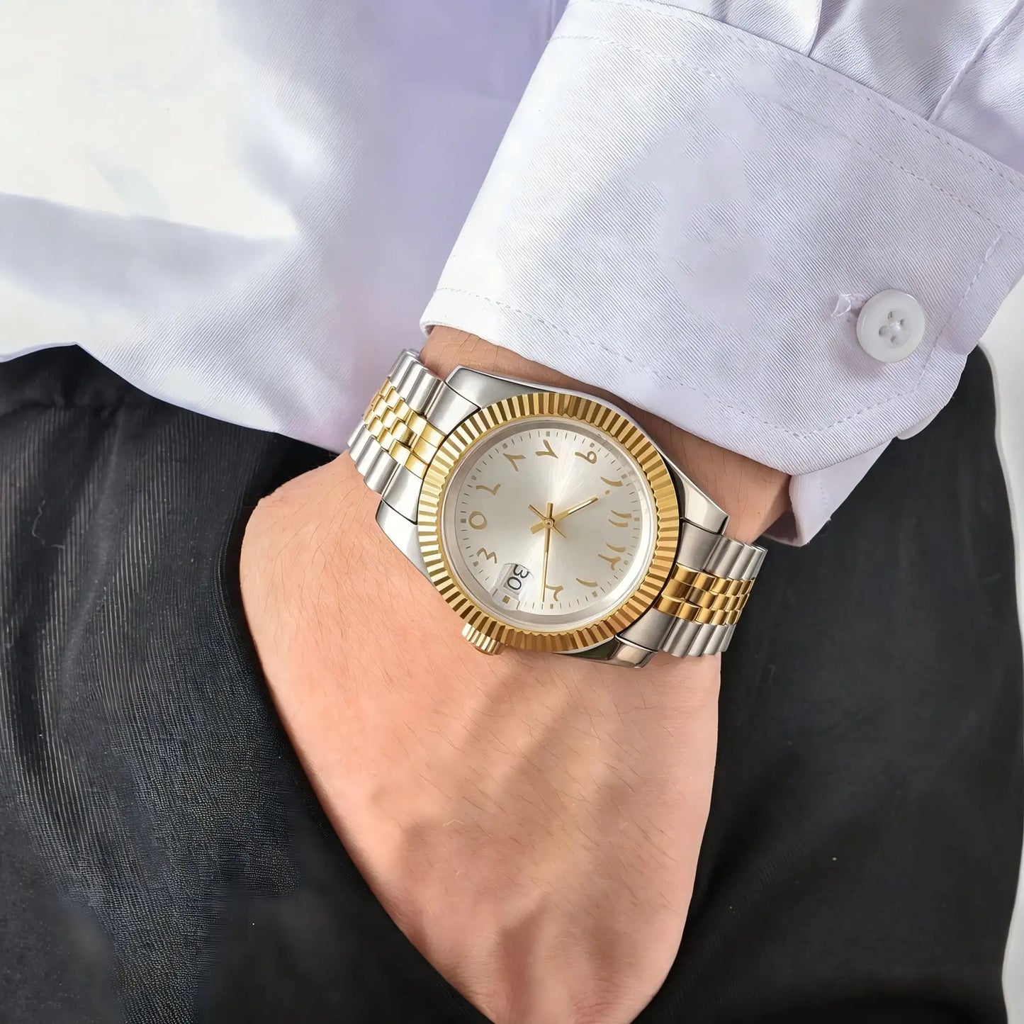 Wrist shot of custom Two-Tone Seiko mod watch worn with a formal suit, showcasing the polished finish and refined dial details