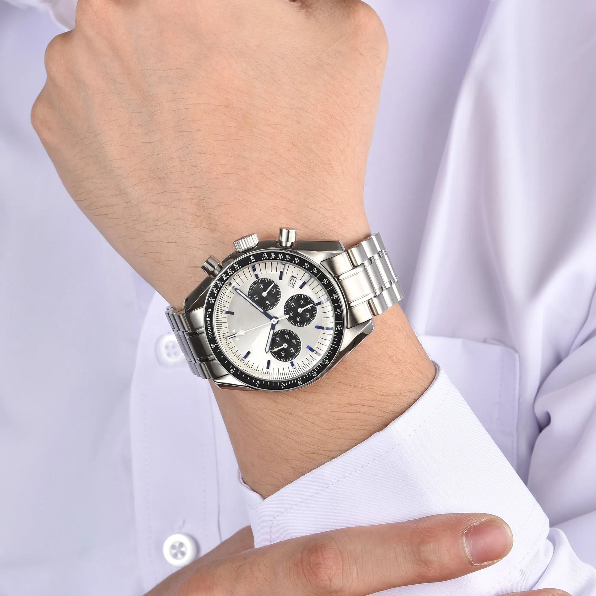 Silver panda chronograph speedmaster style Seiko mod watch on wrist, business lifestyle shot