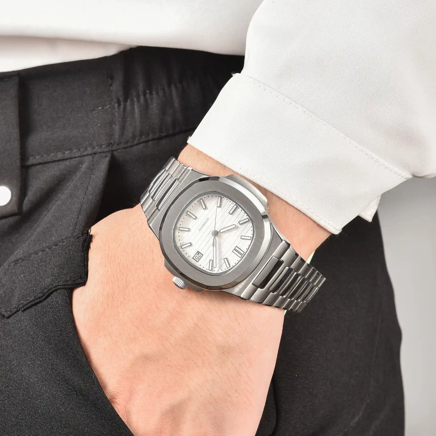 Men's white dial Nautilus style Seiko mod watch on wrist, casual daily wear lifestyle shot